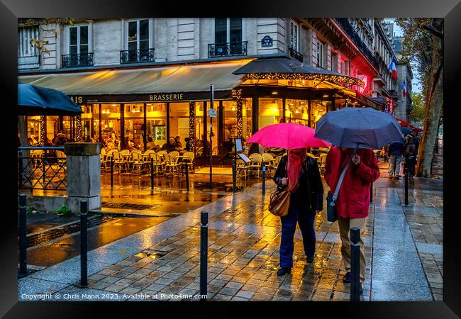 Paris in the rain Framed Print by Chris Mann