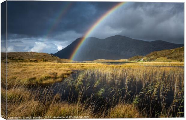 Majestic Rainbow over Scottish Highland Mountains Canvas Print by Rick Bowden
