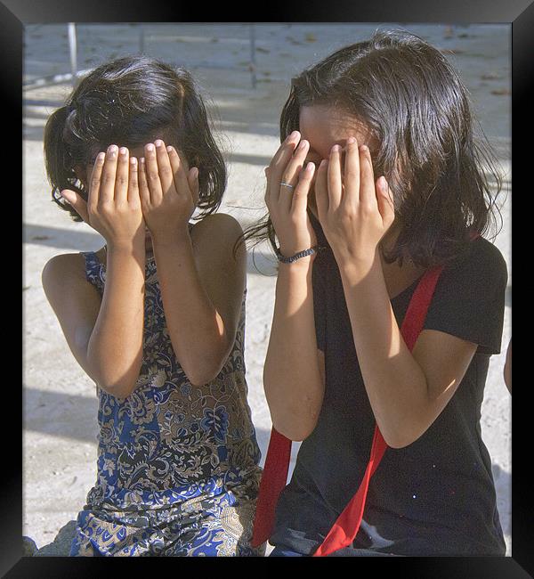 girls hiding Framed Print by Hassan Najmy