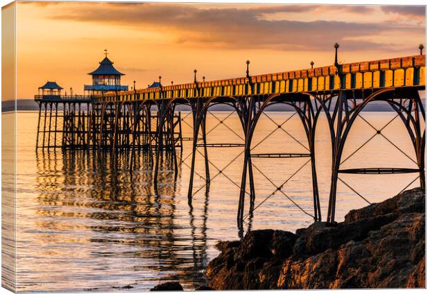Clevedon Pier at Sunset sunlight reflecting onto the sea Canvas Print by Rory Hailes