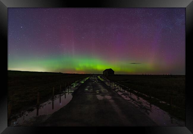 Northern lights dancing over the old coal barn at Thornham  Framed Print by Gary Pearson