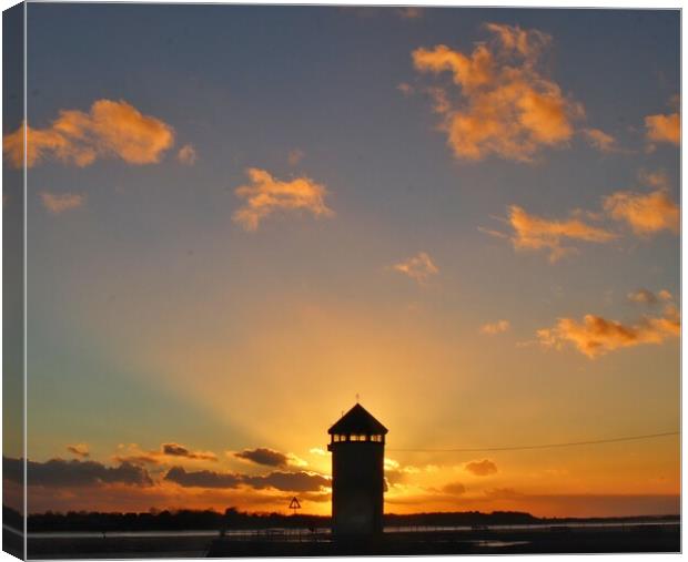 Brightlingsea sunsetting behind Batemans Tower in full colour  Canvas Print by Tony lopez
