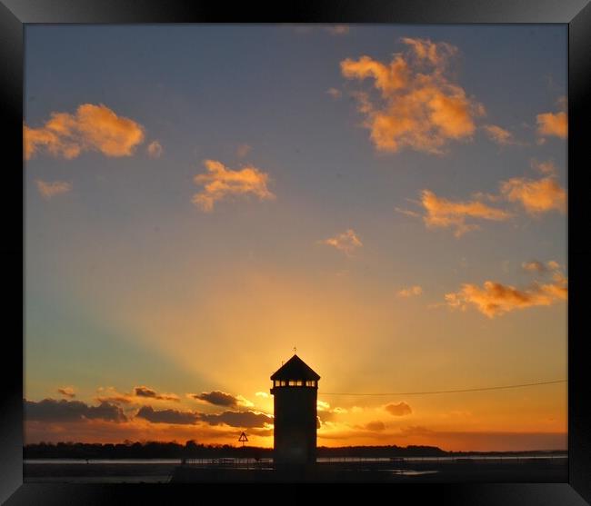 Brightlingsea sunsetting behind Batemans Tower in full colour  Framed Print by Tony lopez