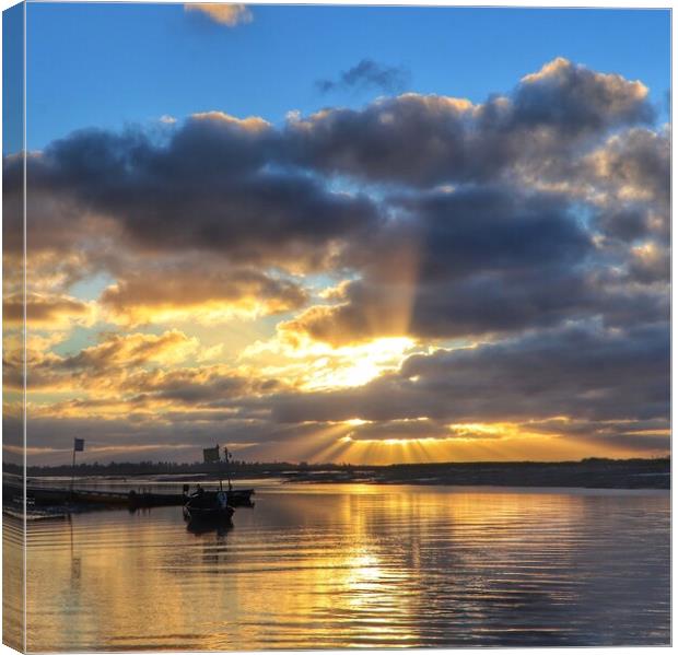 Sunrise rays and cloudscspe over Brightlingsea Creek  Canvas Print by Tony lopez