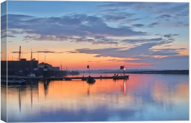 Sunrise colours and reflections over Brightlingsea Harbour in Essex  Canvas Print by Tony lopez