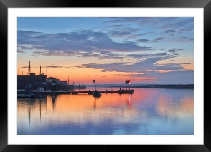 Sunrise colours and reflections over Brightlingsea Harbour in Essex  Framed Mounted Print by Tony lopez