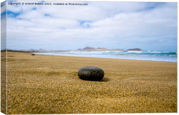 Empty beach with black stone in the foreground Canvas Print by Kristof Bellens
