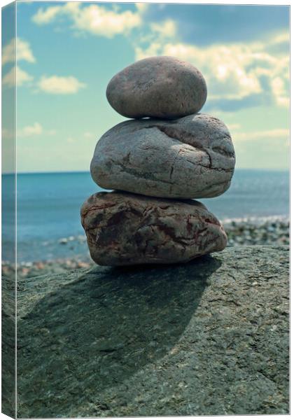Small stone stack on beach Canvas Print by Michael Hopes