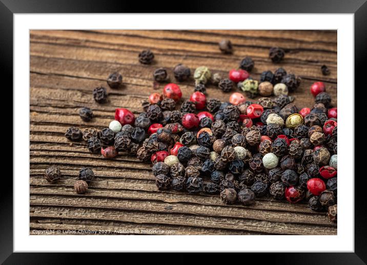 Peppercorns on dark rustic wooden background. Mix of different peppers Framed Mounted Print by Lubos Chlubny
