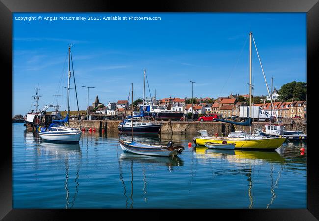 Colourful Boats moored in St Monans harbour Framed Print by Angus McComiskey