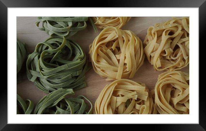 Fresh homemade egg pasta tagliatelle. Raw homemade pasta. Fettuccine pasta raw. Framed Mounted Print by Irena Chlubna