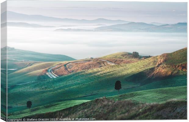 Foggy morning landscape in Volterra. Tuscany, Italy Canvas Print by Stefano Orazzini