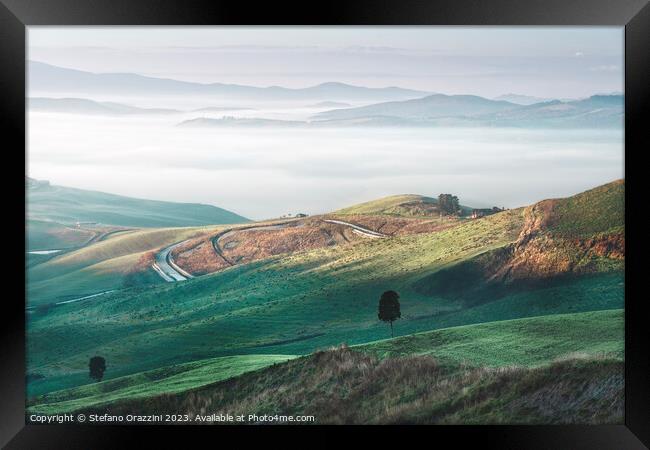 Foggy morning landscape in Volterra. Tuscany, Italy Framed Print by Stefano Orazzini