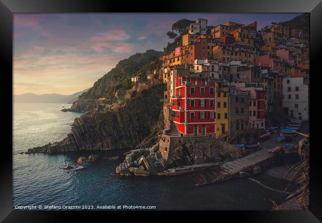 Riomaggiore village view at sunset. Cinque Terre, Italy Framed Print by Stefano Orazzini