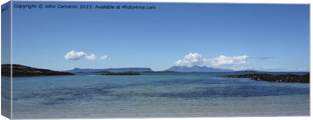 Eigg and Rum from Traigh. Canvas Print by John Cameron