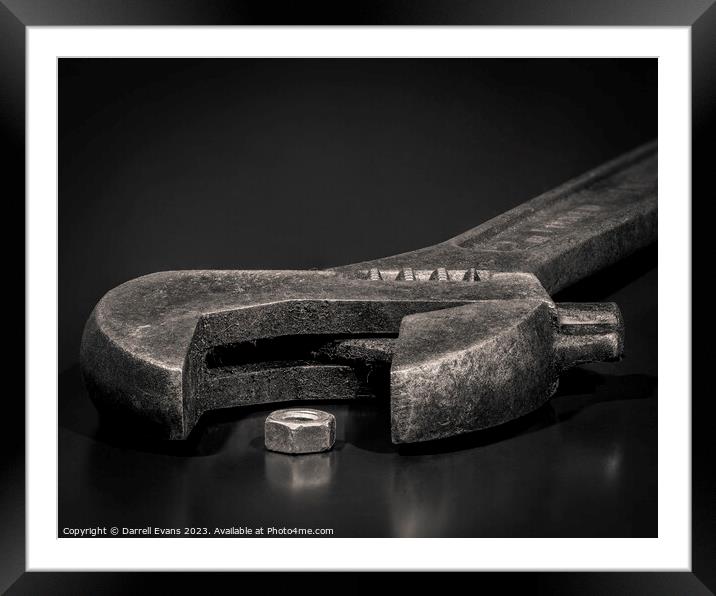 Wrench and nut Framed Mounted Print by Darrell Evans