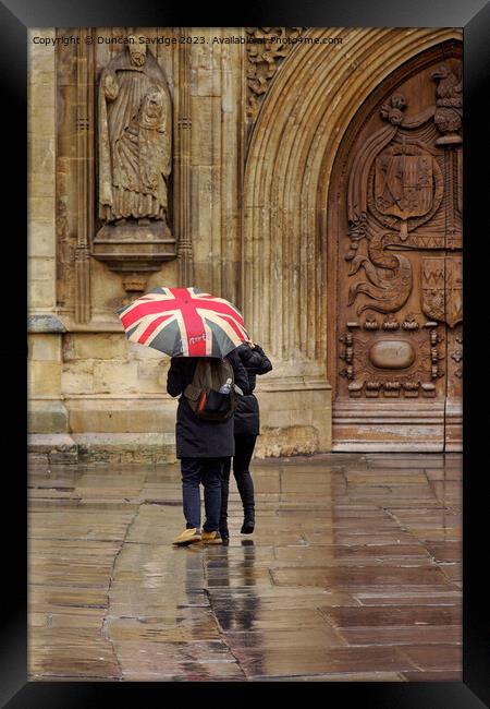 Union jack umbrella outside Bath Abbey Framed Print by Duncan Savidge