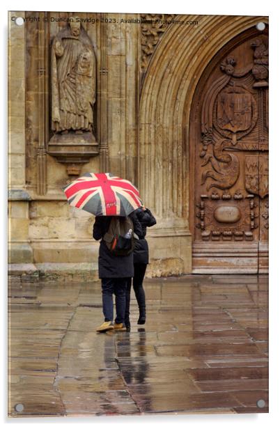 Union jack umbrella outside Bath Abbey Acrylic by Duncan Savidge