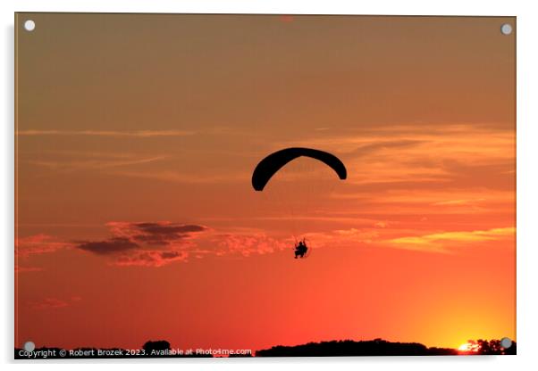 Paraglider at Sunset with a colorful sky. Acrylic by Robert Brozek