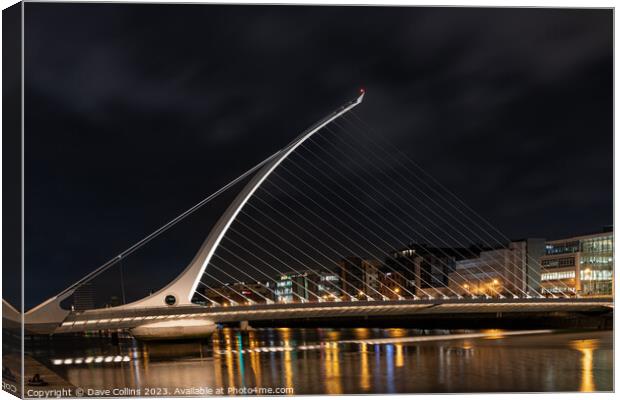 The Samuel Beckett Bridge over the River Liffey illuminated at night  (Looking upstream from the south bank), Dublin, Ireland Canvas Print by Dave Collins