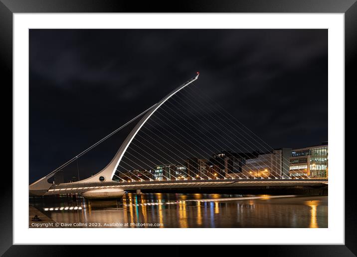 The Samuel Beckett Bridge over the River Liffey illuminated at night  (Looking upstream from the south bank), Dublin, Ireland Framed Mounted Print by Dave Collins