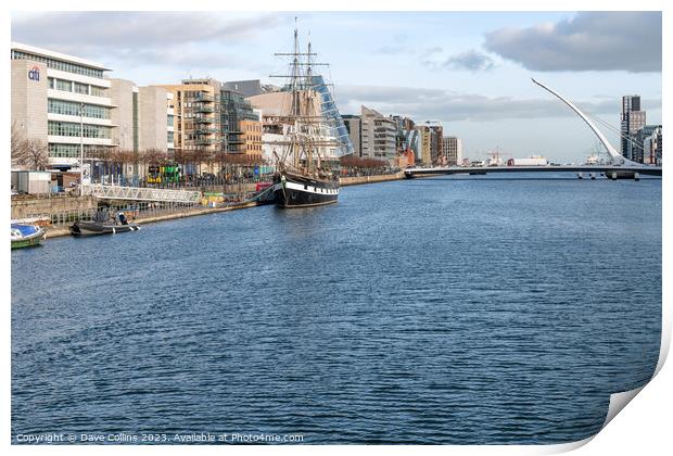 Tall Ship replica, Jeanie Johnston moored on the River Liffey and the river front buildings, Dublin, Ireland Print by Dave Collins