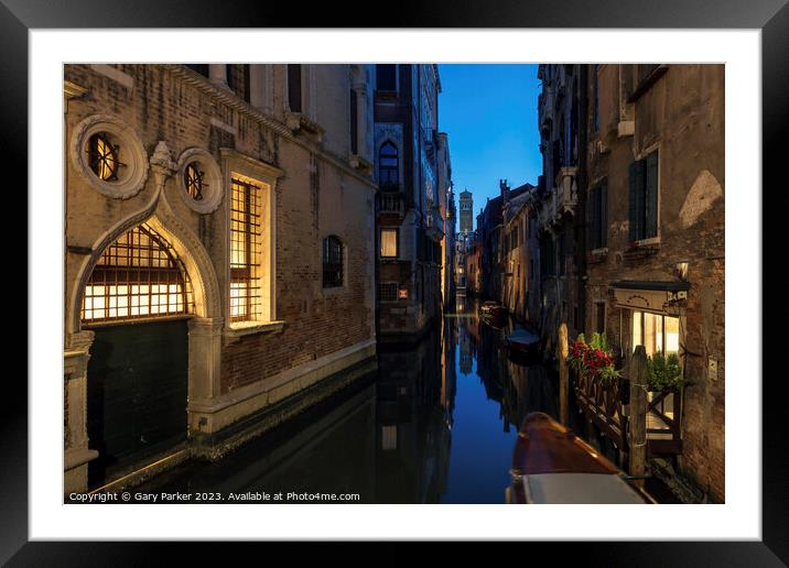 Venetian canal at night time Framed Mounted Print by Gary Parker