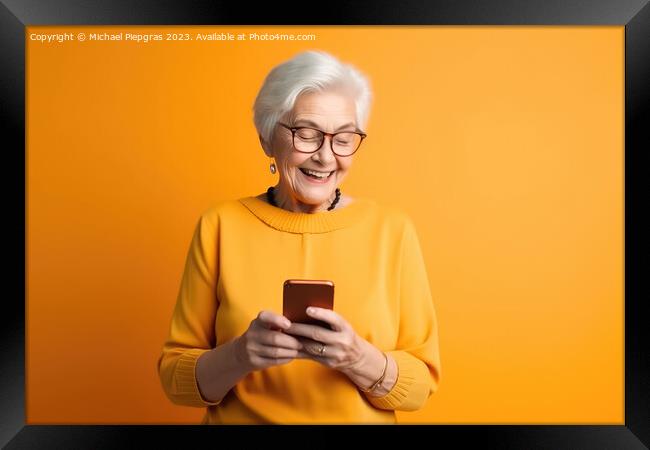 A happy retired old woman holding a smartphone in her hands crea Framed Print by Michael Piepgras