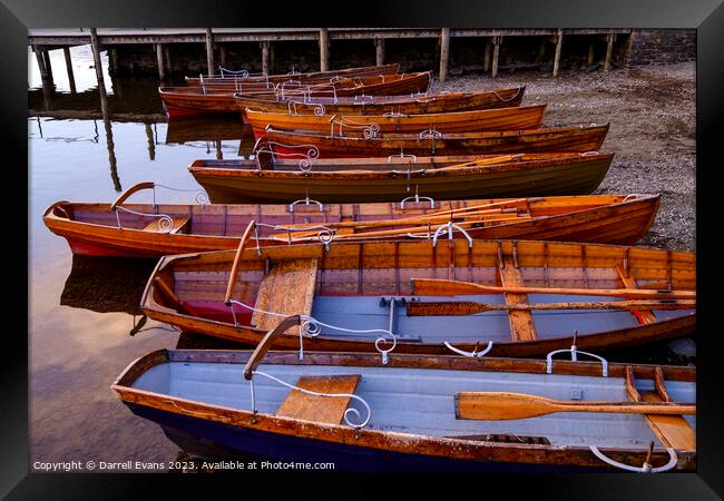 Boats in a row Framed Print by Darrell Evans