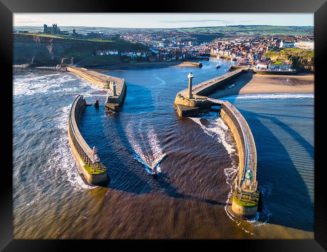 Boat leaves Whitby Harbour Framed Print by Tim Hill