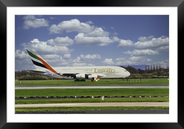 Emirates getting ready for take off Framed Mounted Print by simon cowan