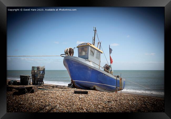 Small Blue Fishing Boat Framed Print by David Hare