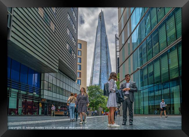 Life in The City under The Shard Framed Print by Adrian Rowley