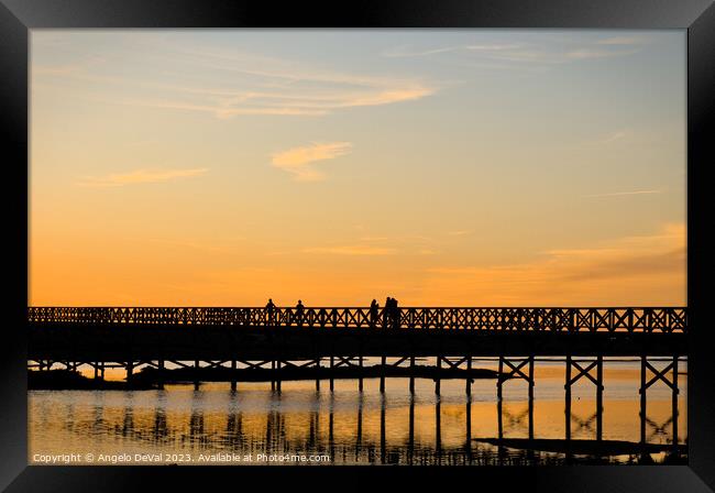 Wooden bridge welcoming twilight Framed Print by Angelo DeVal