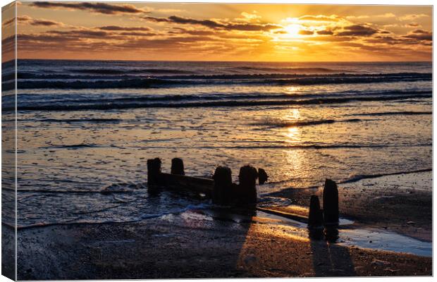 Golden rays over tranquil Sandsend Canvas Print by Tim Hill