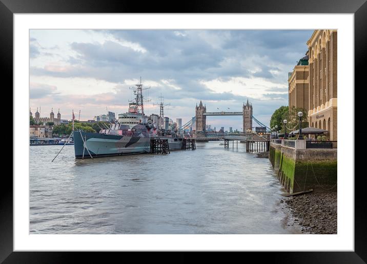 HMS Belfast lights up in red Framed Mounted Print by Jason Wells