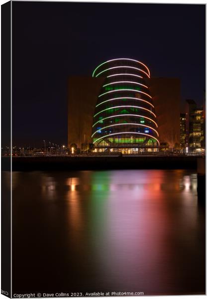 The lights of the Dublin Convention Centre reflected in the river Liffey at night Canvas Print by Dave Collins