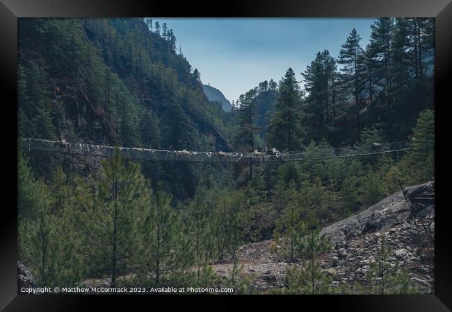 Rope Bridge across the valley Framed Print by Matthew McCormack