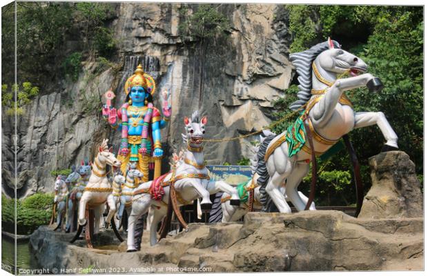Hindu God with horse carriage at Ramayana Cave Canvas Print by Hanif Setiawan