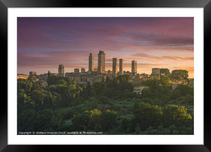 The towers of the village of San Gimignano at sunset. Tuscany, Italy Framed Mounted Print by Stefano Orazzini