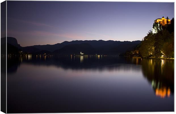 View across Lake Bled at dusk Canvas Print by Ian Middleton