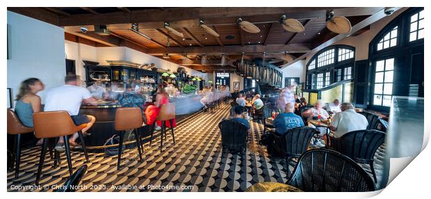The long bar at Raffles Hotel, Singapore. Print by Chris North