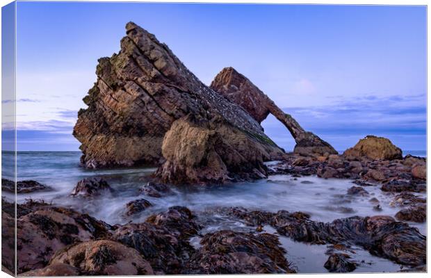 Crashing tide at Bow fiddle rock Canvas Print by Kevin Winter