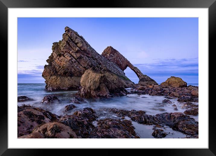 Crashing tide at Bow fiddle rock Framed Mounted Print by Kevin Winter