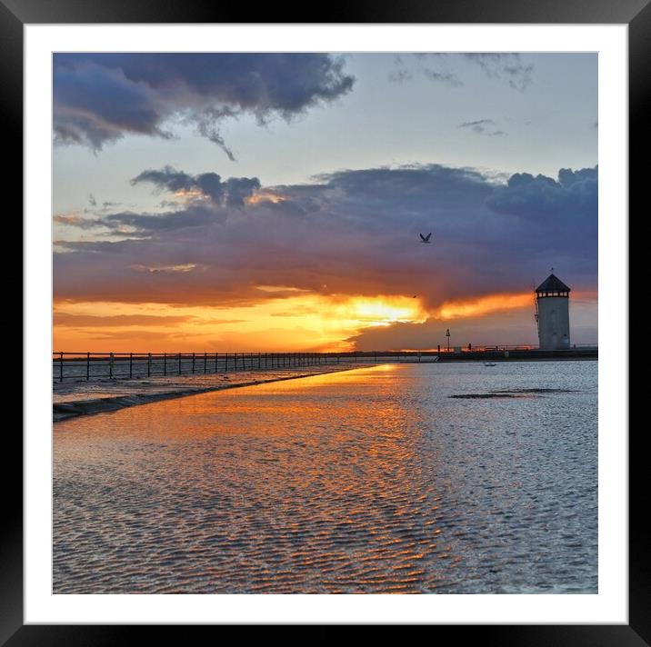 Sun setting over the tidal pool in Brightlingsea  Framed Mounted Print by Tony lopez