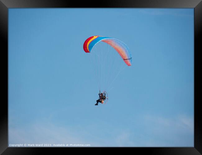 Powered Paragliding over Bexhill. Framed Print by Mark Ward