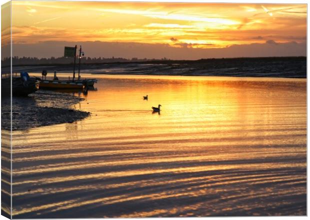 Golden sunrise over the Brightlingsea Creek  Canvas Print by Tony lopez