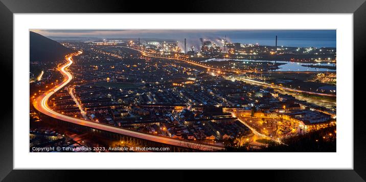 Port Talbot and Steel Works at night with the trails of car lights on the M4 motorway Framed Mounted Print by Terry Brooks