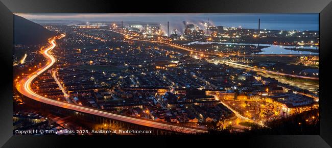 Port Talbot and Steel Works at night with the trails of car lights on the M4 motorway Framed Print by Terry Brooks