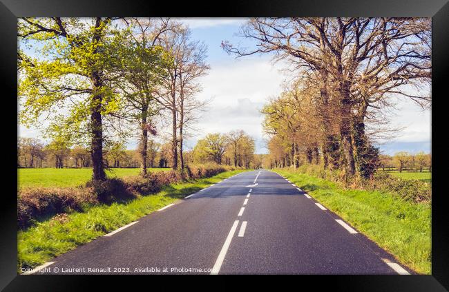 Driving on a rural french country road Framed Print by Laurent Renault